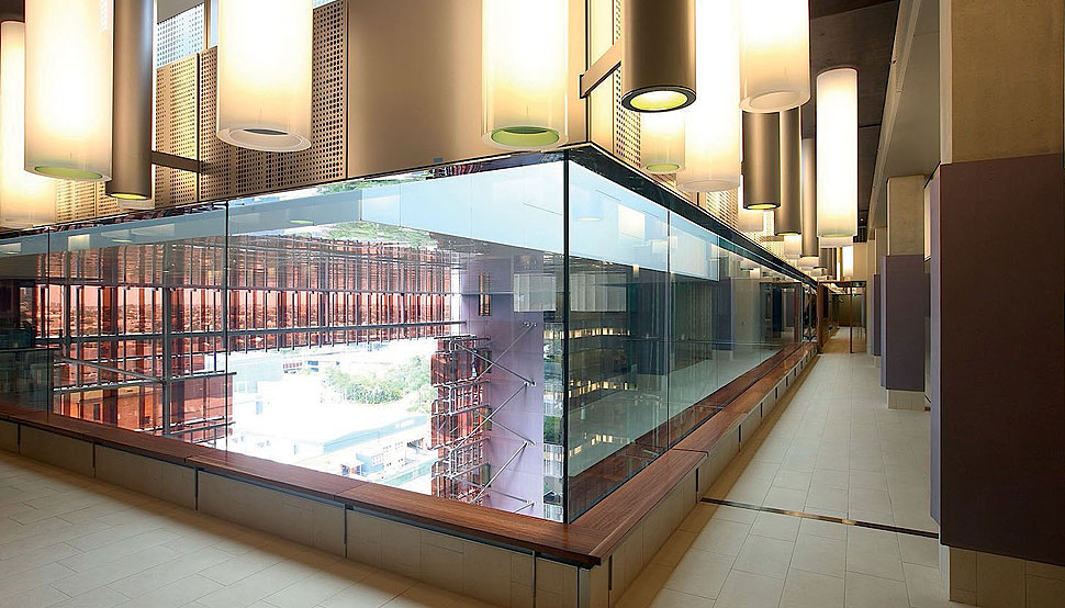 The atrium is enclosed by walls of glazing and a glass ceiling