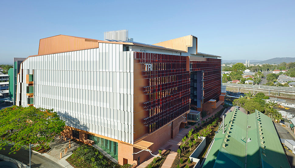 The eastern facade features a sunscreen of perforated aluminium shades clipped to the exterior with galvanised steel framing.